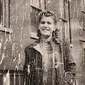woman-in-jacket-damaged-photo-Example.webp